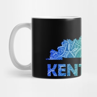 Colorful mandala art map of Kentucky with text in blue and green Mug